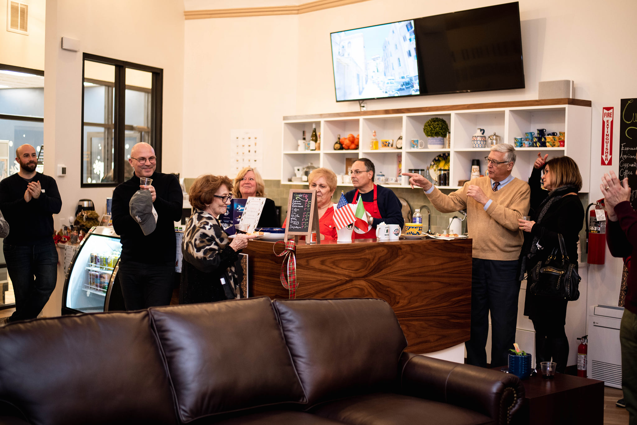 Patrons and volunteers gather at espresso bar at CCI